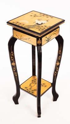 Lot 1021 - A Japanese lacquer jardinière stand decorated...