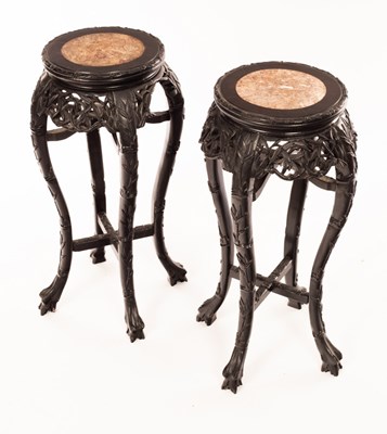 Lot 1045 - A pair of Chinese vase stands, the top 28cm...