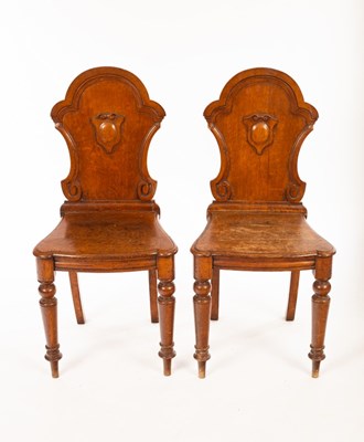 Lot 1105 - A pair of Victorian oak chairs with cartouche...