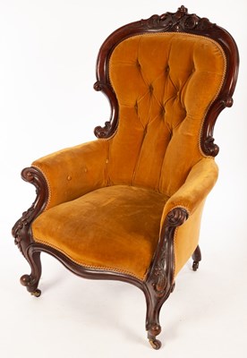 Lot 1106 - A Victorian walnut armchair with deep button...