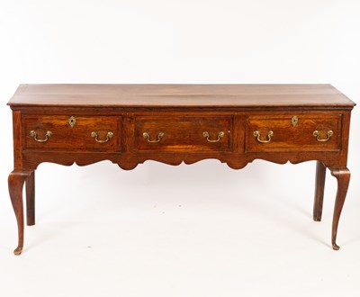 Lot 1107 - A late 18th Century oak dresser base, fitted...