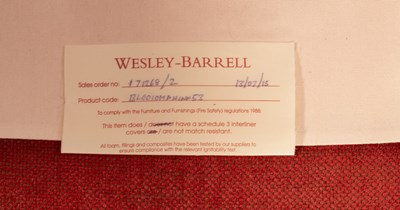 Lot 1117 - A Wesley Barrell wingback recliner armchair,...