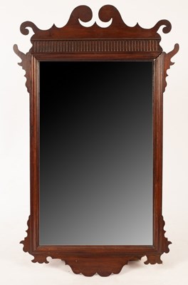 Lot 1121 - An 18th Century upright wall mirror, in a...