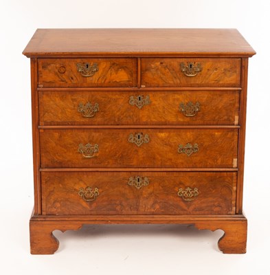 Lot 1132 - An early 18th Century walnut chest of three...