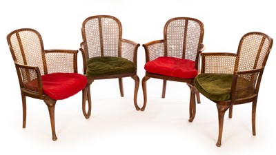 Lot 1140 - Four mahogany armchairs with cane backs and...