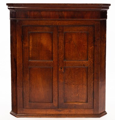 Lot 1145 - An early 19th Century oak hanging corner...