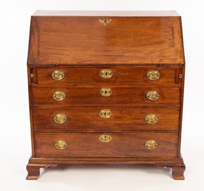 Lot 1150 - A George III mahogany bureau, the sloping...