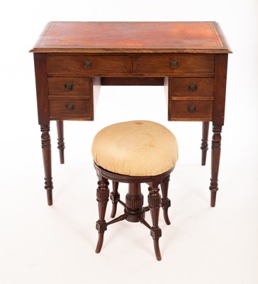 Lot 1166 - A kneehole writing table, fitted a surround of...