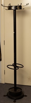 Lot 1175 - A twin-division hat and stick stand with drip...