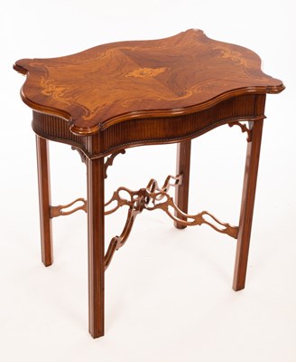 Lot 1203 - A Georgian style walnut serpentine top table,...