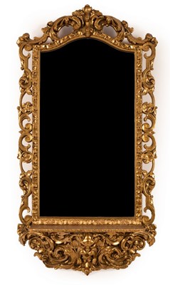 Lot 1204 - A gilt framed hall mirror, the arched plate in...