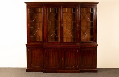 Lot 1232 - A George III style mahogany breakfront...