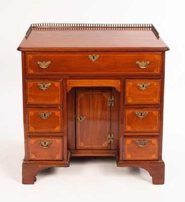 Lot 1239 - A George III mahogany and inlaid kneehole desk...