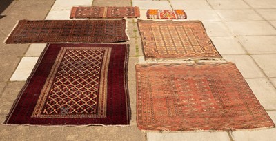 Lot 1268 - A Bokhara rug on red ground, ivory details...