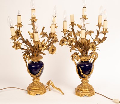 Lot 1276 - A pair of five-light table lights with gilded...