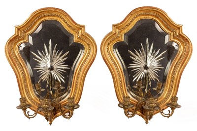 Lot 1282 - A pair of gilt framed girandoles of cartouche...