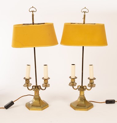 Lot 1283 - A pair of brass two-branch table lamps, on...