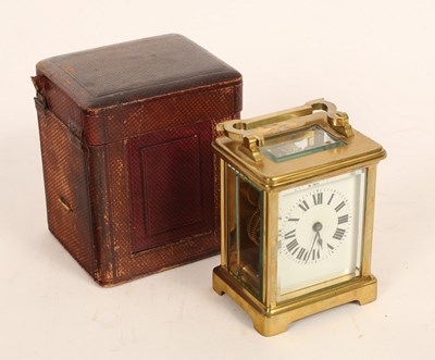 Lot 1291 - A French carriage time piece in gilt brass...