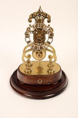 Lot 1295 - A 19th Century brass skeleton clock beneath a...