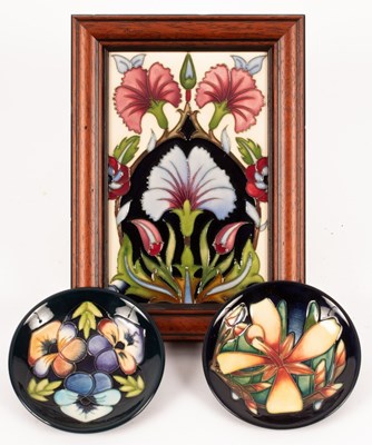 Lot 1320 - A framed Moorcroft plaque decorated stylised...