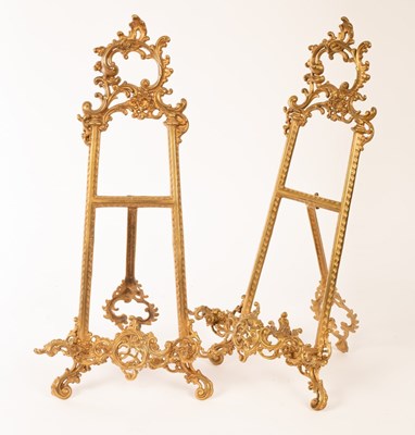 Lot 1358 - A pair of Rococo style gold painted, metal...