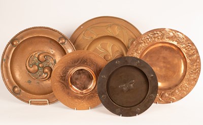 Lot 1373 - Five embossed copper chargers, the largest...