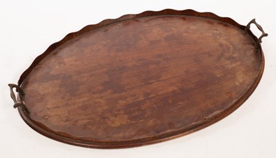 Lot 1392 - An Edwardian mahogany two-handled tray with a...