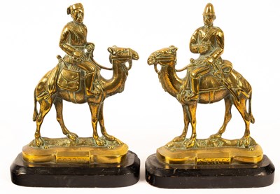 Lot 1395 - A pair of Victorian brass doorstops depicting...