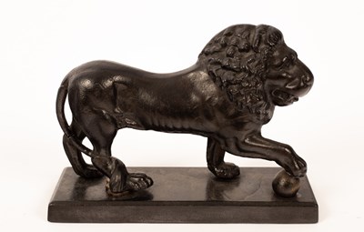 Lot 1399 - A cast iron figure of a lion, Kenrick & Sons,...