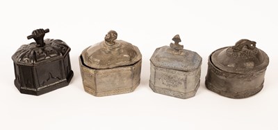 Lot 1401 - Four tobacco jars with decorative handles in...