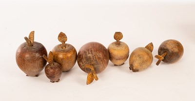 Lot 1409 - Seven treen pieces of fruit, each with metal...