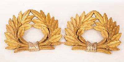 Lot 1411 - A pair of carved and gilded wall appliques of...