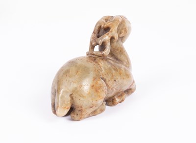 Lot 23 - A Chinese jade carving of a recumbent stag
