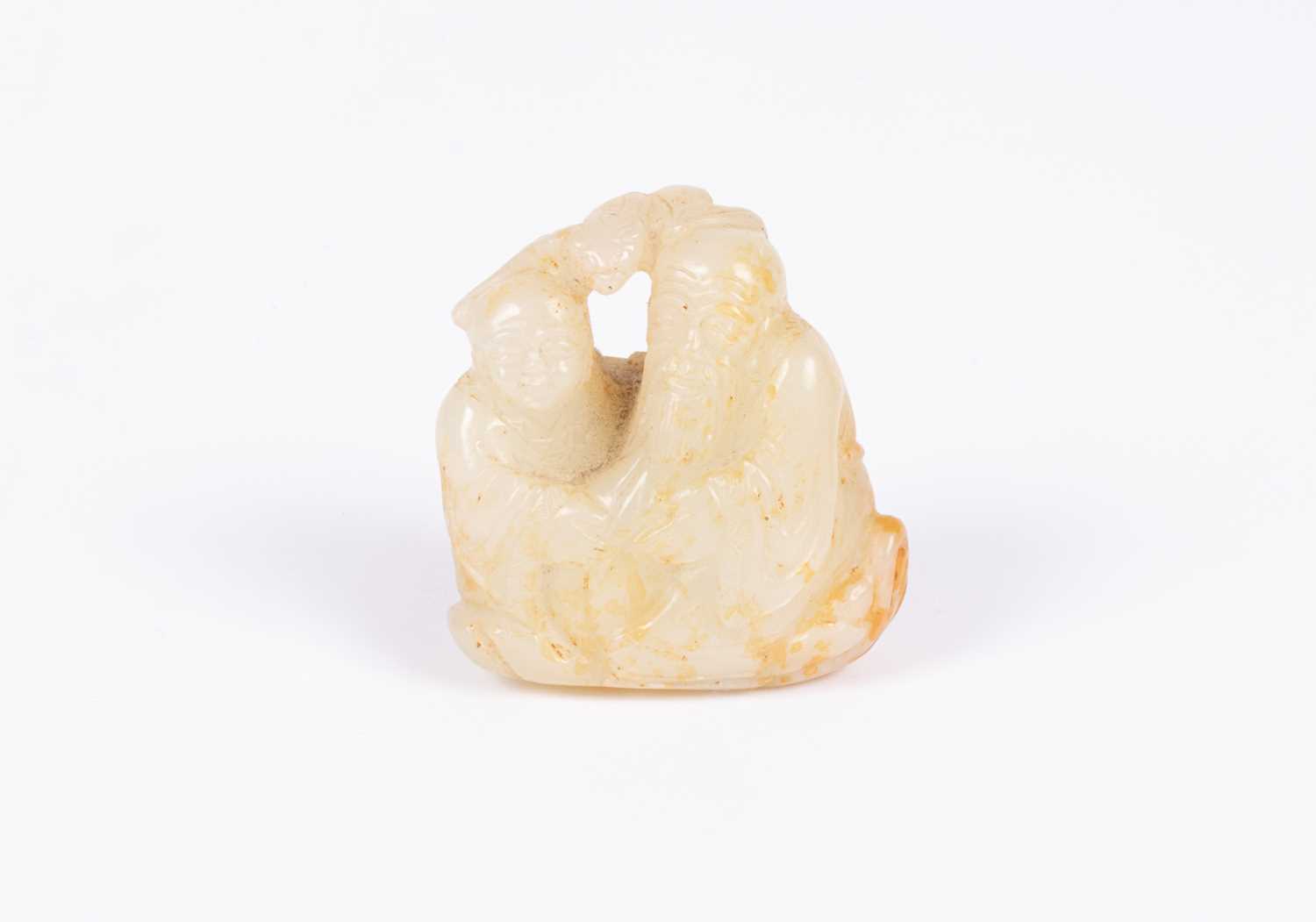 Lot 26 - A Chinese jade carving of an old man and a boy