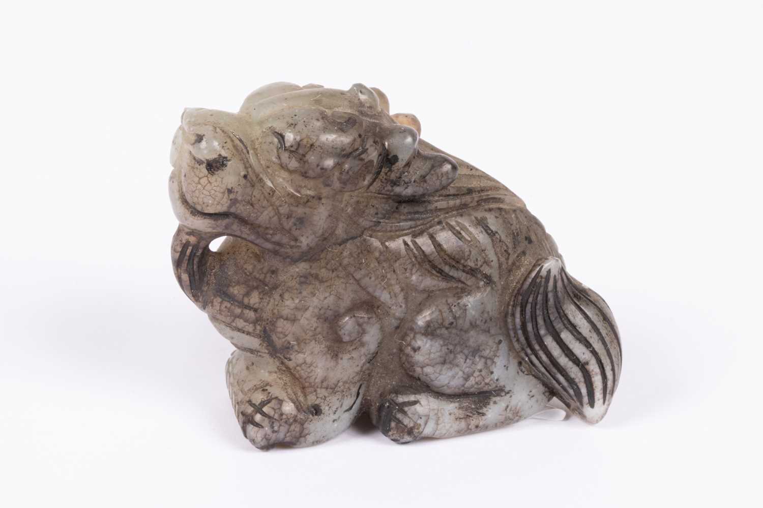 Lot 27 - A Chinese jade carving of a grotesque beast