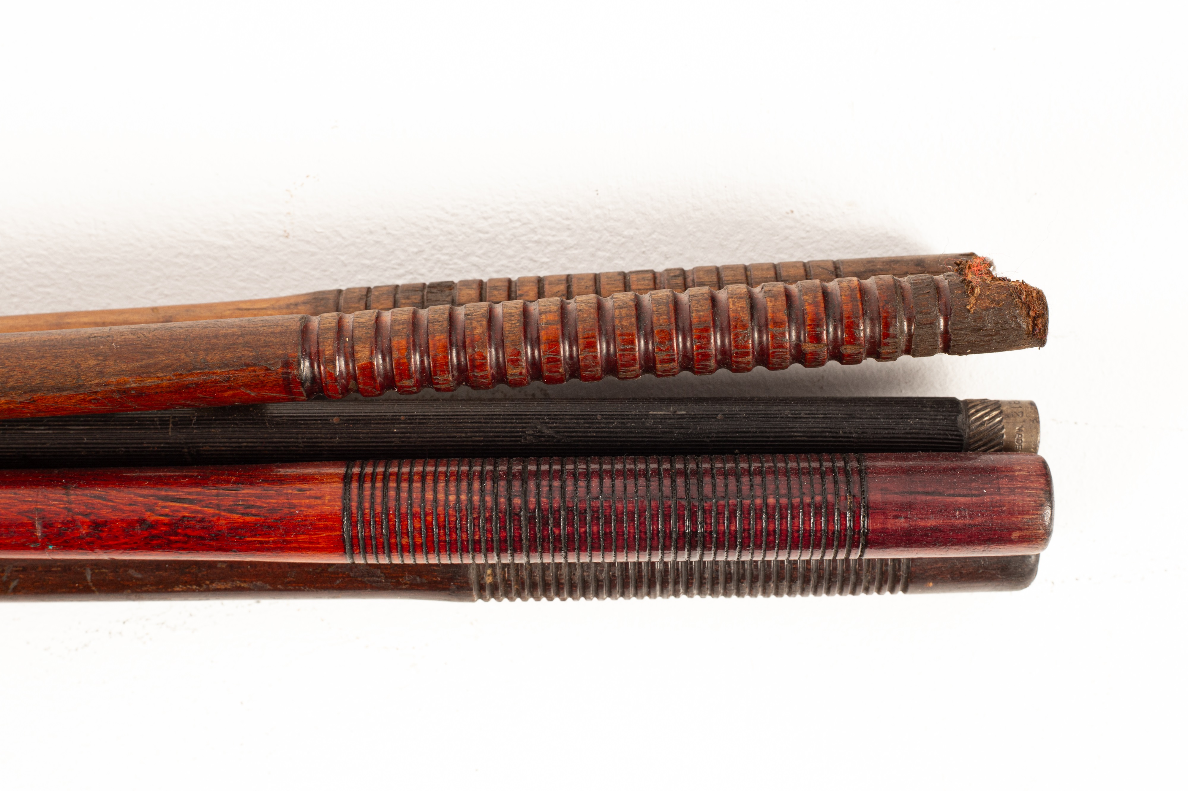 Lot 220 - Eight turned wood, brass mounted gun rods