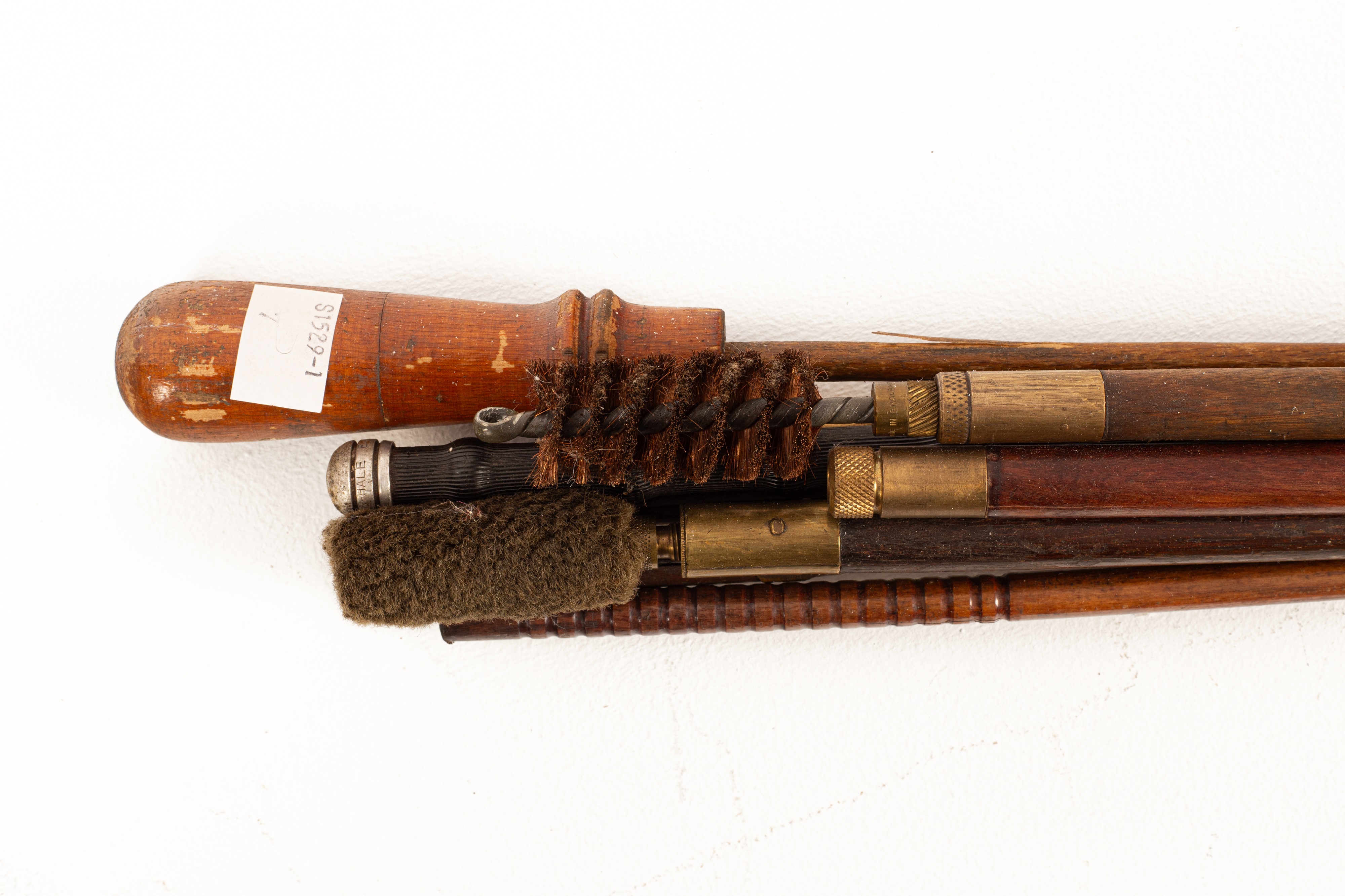 Lot 220 - Eight turned wood, brass mounted gun rods