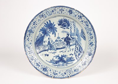 Lot 219 - A Dutch blue and white delft charger