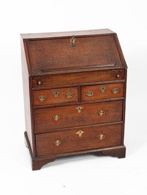 Lot 370 - An early 18th Century oak bureau