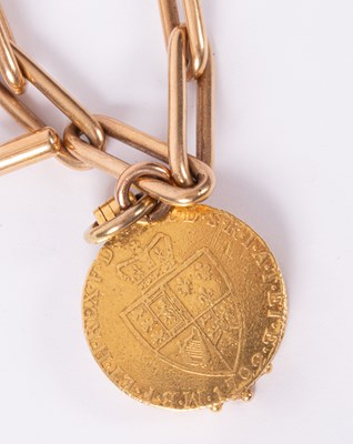 Lot 29 - A 15ct gold albert chain with George III guinea locket