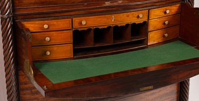 Lot 598 - A Regency mahogany bowfront secretaire chest on chest
