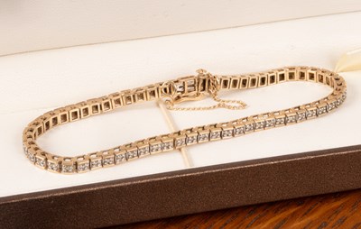 Lot 80 - A 9ct gold and diamond tennis bracelet