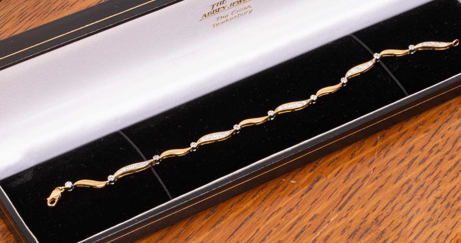 Lot 81 - An 18ct gold and diamond bracelet