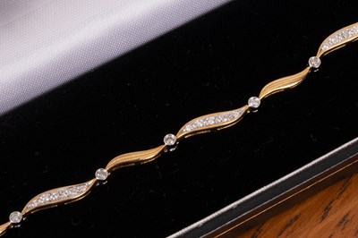 Lot 81 - An 18ct gold and diamond bracelet
