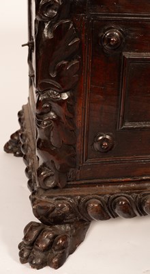 Lot 590 - A 17th Century Italian walnut carved and panelled cassone