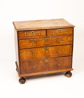 Lot 436 - An early 18th Century walnut and featherbanded chest of drawers