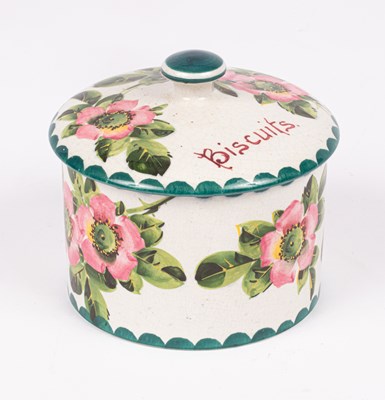 Lot 243 - A Wemyss cylindrical biscuit box and cover