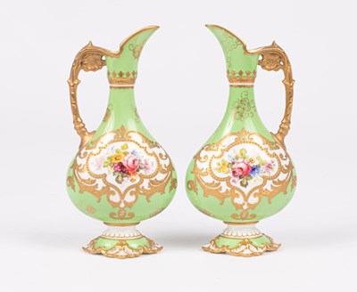 Lot 239 - A pair of Royal Crown Derby small ewers