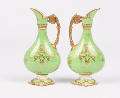 Lot 239 - A pair of Royal Crown Derby small ewers