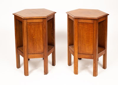 Lot 431 - A pair of Arts & Crafts oak hexagonal bedside tables